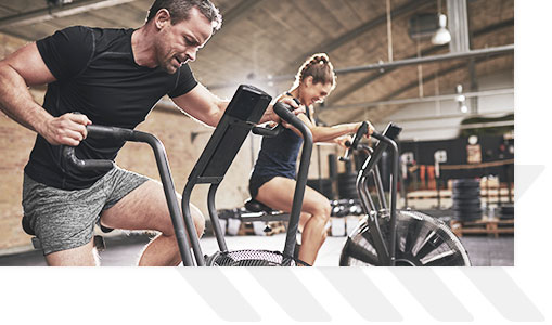 Man and woman on cardio machines