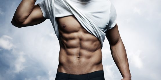 Shredded Guy Lifting Up his White Shirt to Show Off Six-Pack Abs