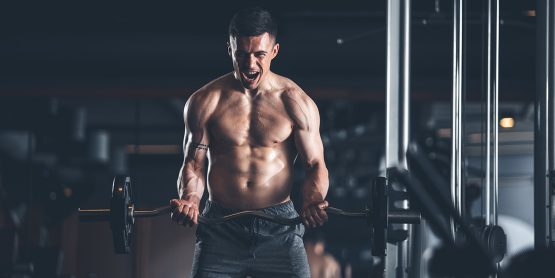 Shredded Guy Doing Barbell Curls